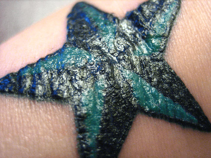 bumpy and raised tattoo of a starfish