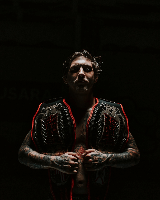 martial arts fighter covered in tattoos