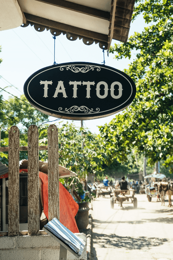 black and white Tattoo-printed signage